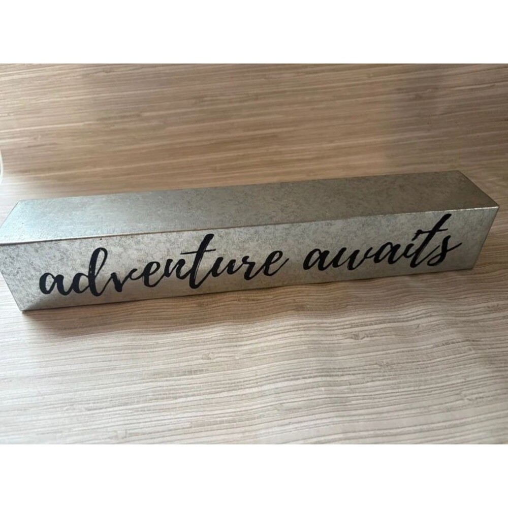 Hobby lobby adventure awaits sign